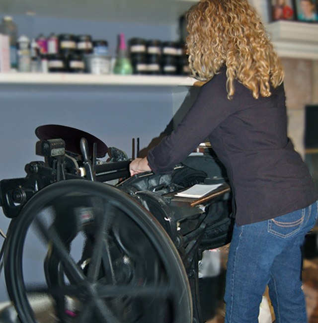 Elecia printing on her late 1800s Chandler & Price platen press
