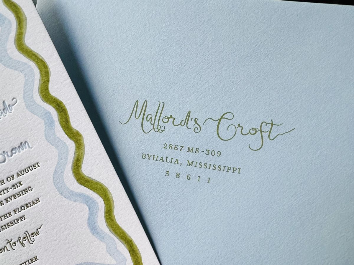 Letterpress wedding invitation suite with a wavy blue and green scalloped border and a monogram, image 14 of 17
