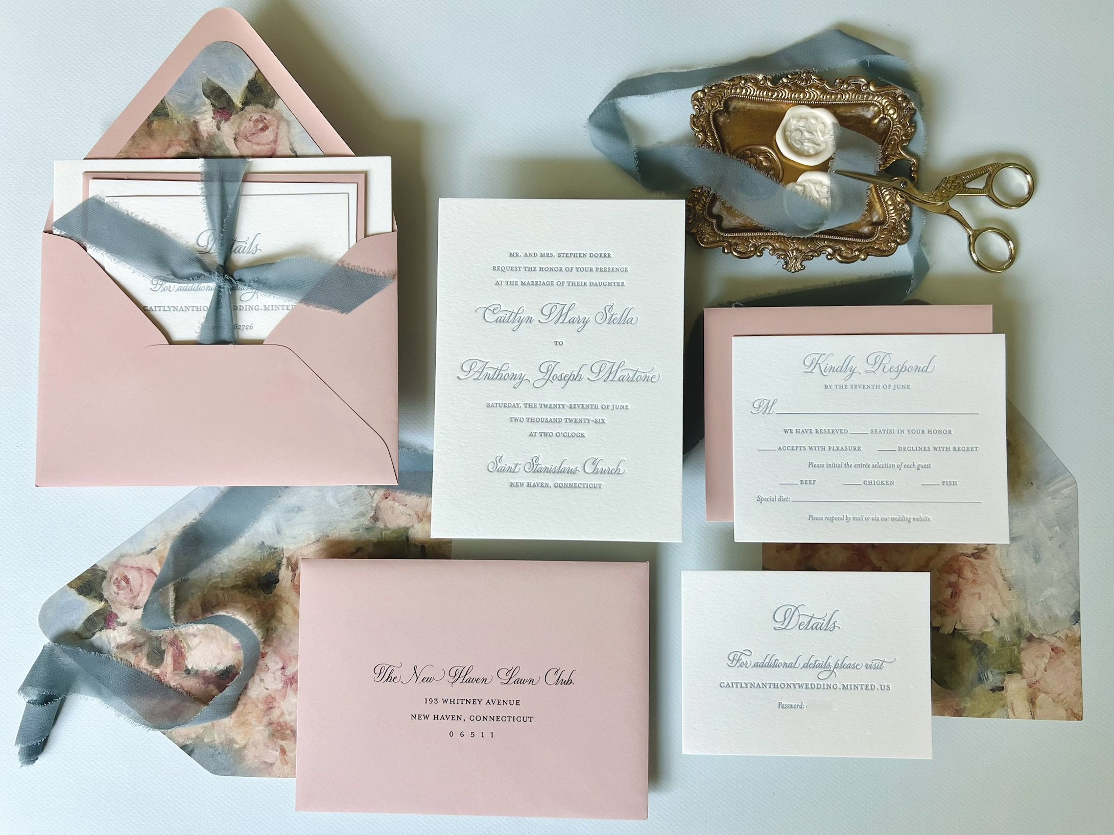 Blush and dusty blue letterpress wedding invitation suite with a painted floral envelope liner, silk ribbon and wax seals