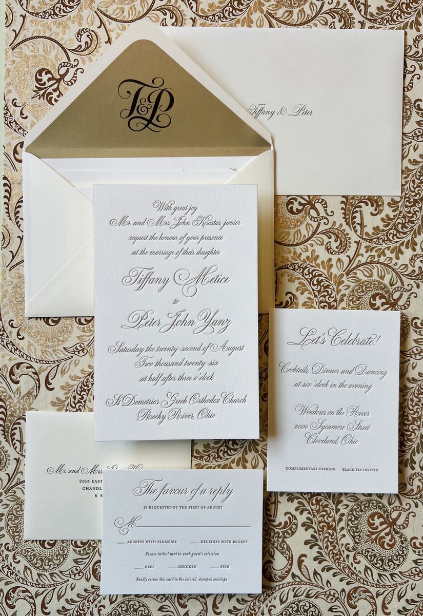 Letterpress wedding invitation suite in gold and cream with a patterned envelope liner